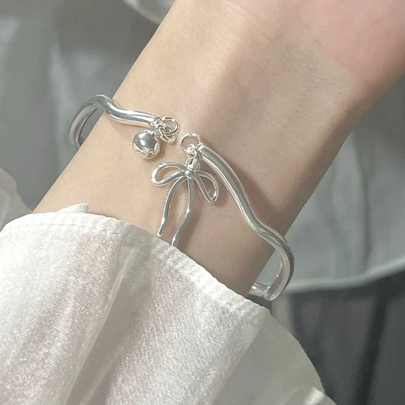 silver-tone-bow-ribbon-amp-bell-cha_1320_w1va.webp